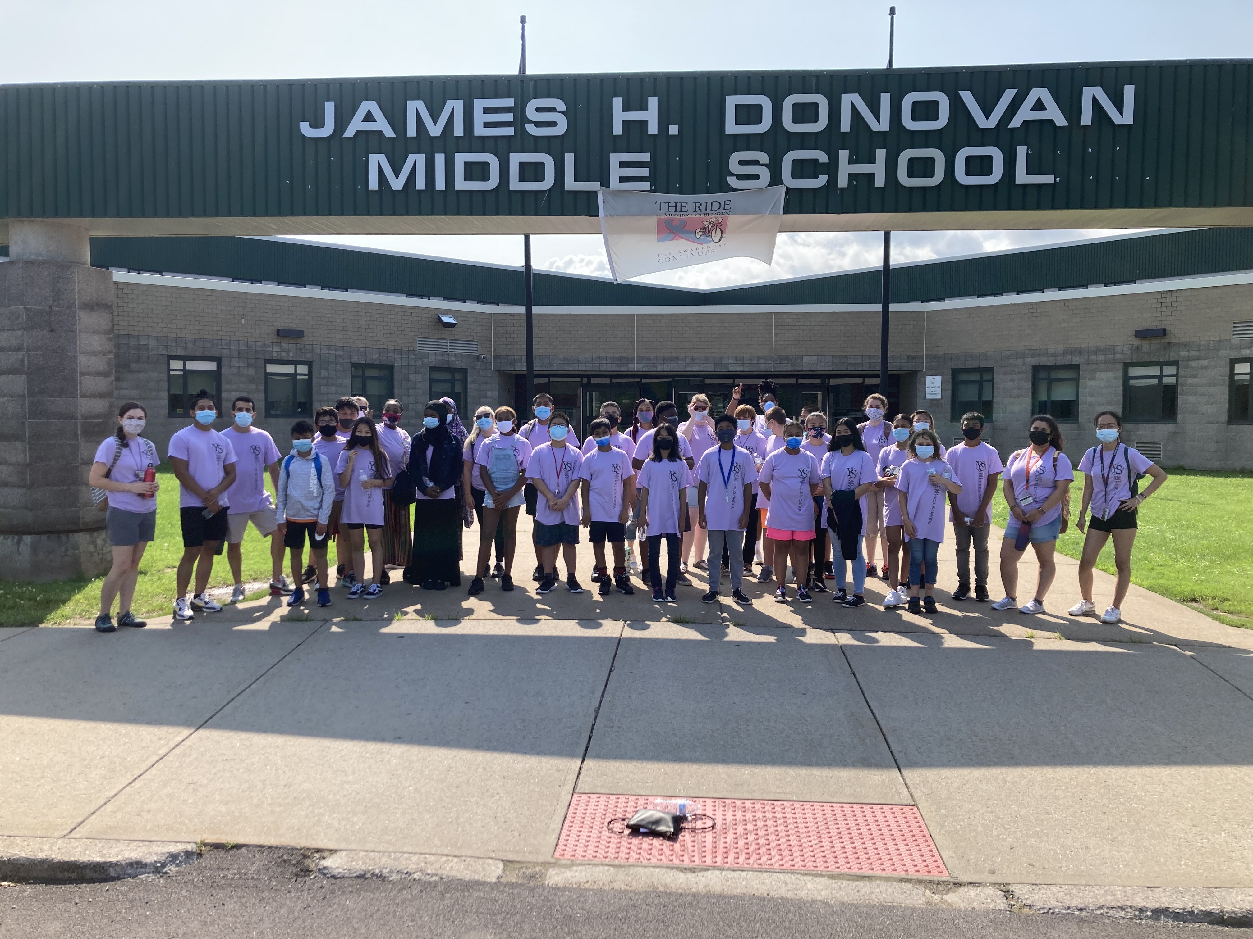 A group of 7th grade Young Scholars posed outside of Donovan Middle School. 