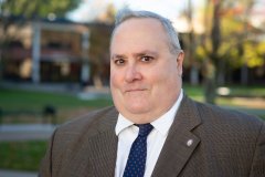 James Teliha stands on campus.