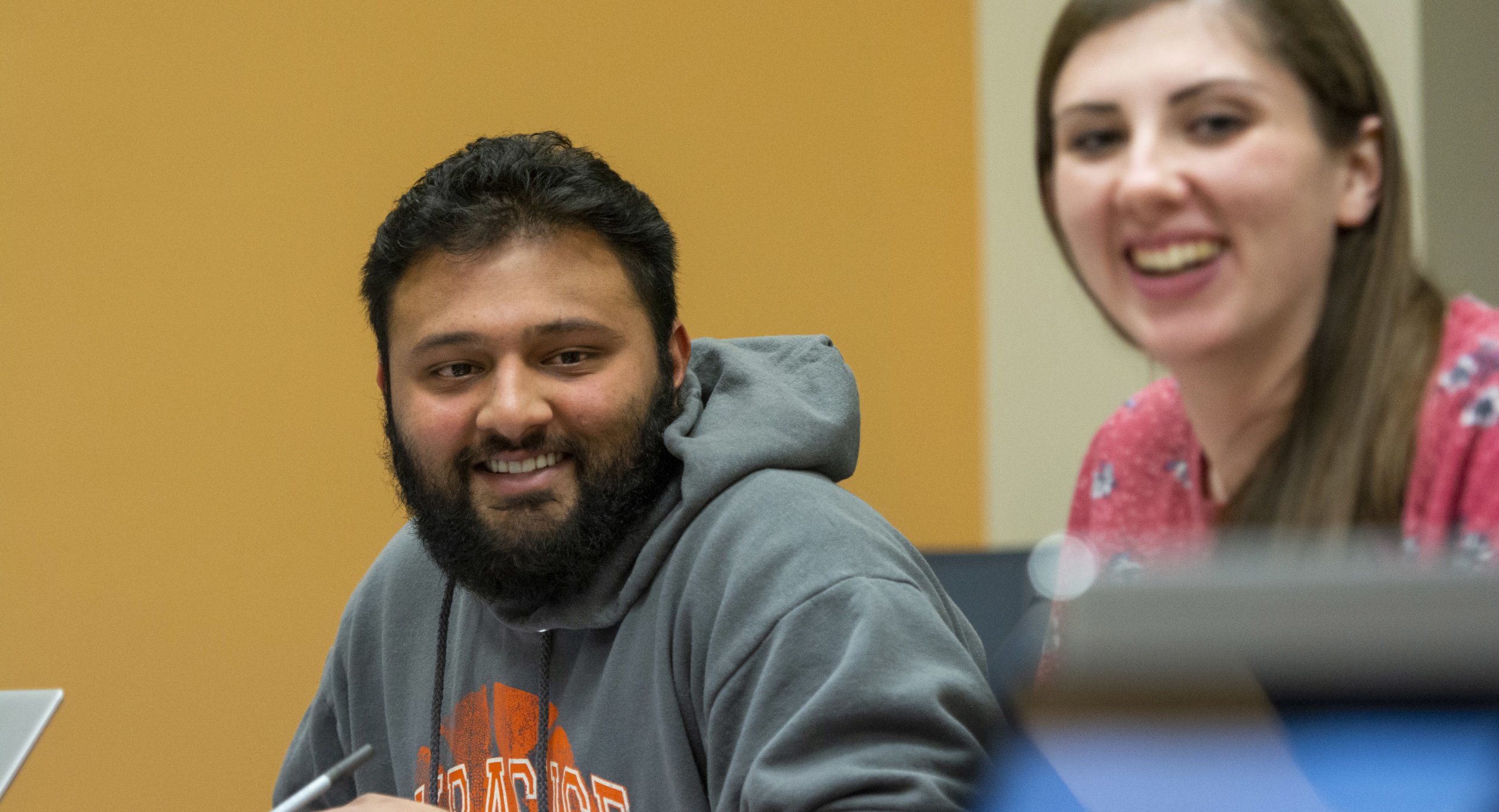 Students smiling in Nesbitt Business class 611_0155