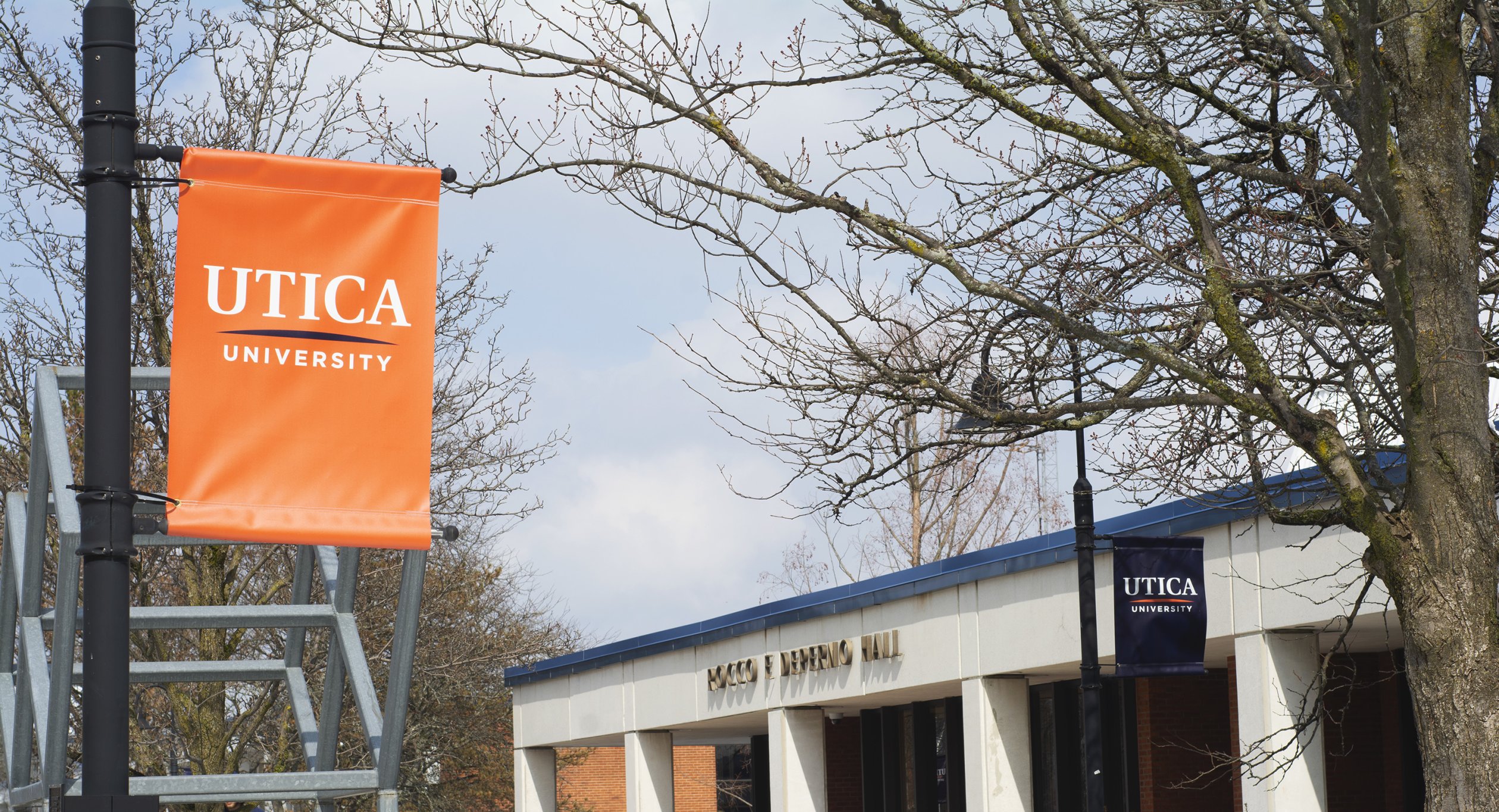 Utica University banners hang outside Rocco DePerno Hall.