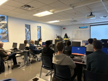 Maame Yaa Boakye '20 speaks with students in the Utica University Investment Club about her journey from Utica to Goldman Sachs.