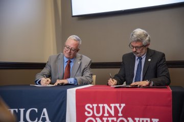 Presidents from Utica University and SUNY Oneonta sign an Articulation Agreement on January 24, 2024.