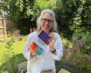 Linnea Franits with her book - An Arts-Based Inquiry of Sibling Disability: Stealing from My Sister’s Plate