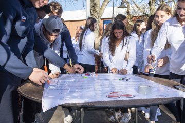 Students sign a commitment to uphold the shared values and create an open and inclusive community on campus.