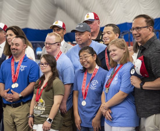 Members of the NYS Special Olympics pose with local politicians.