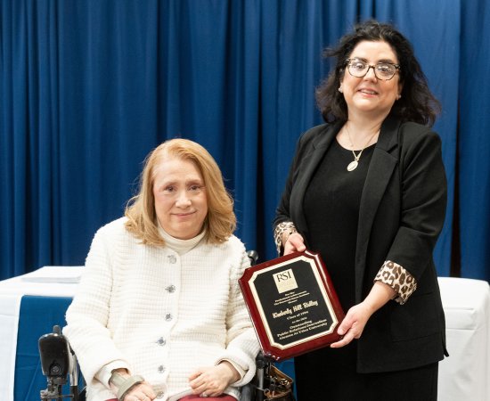 Kimberly Hill Ridley '94 receiving award