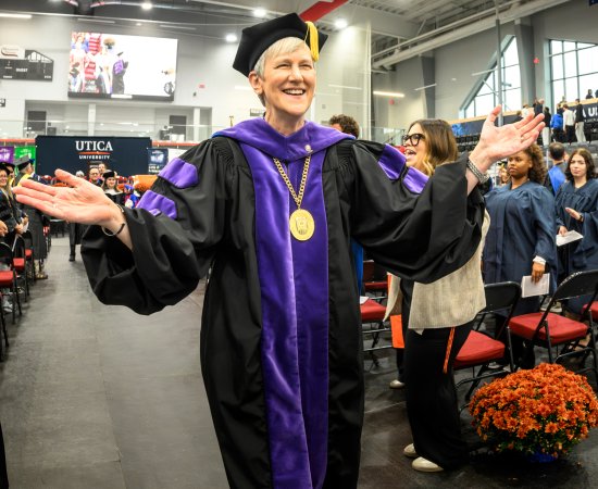President Stephanie Nesbitt exits past the crowd at her presidential inauguration.