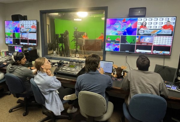 Students in control room producing a TV broadcast program.