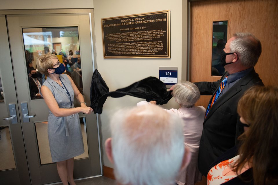 President Laua Casamento and Provost Todd Pfannestiel reveal a plaque during a dedication ceremony of the Wilcox Center on September 08, 2021.