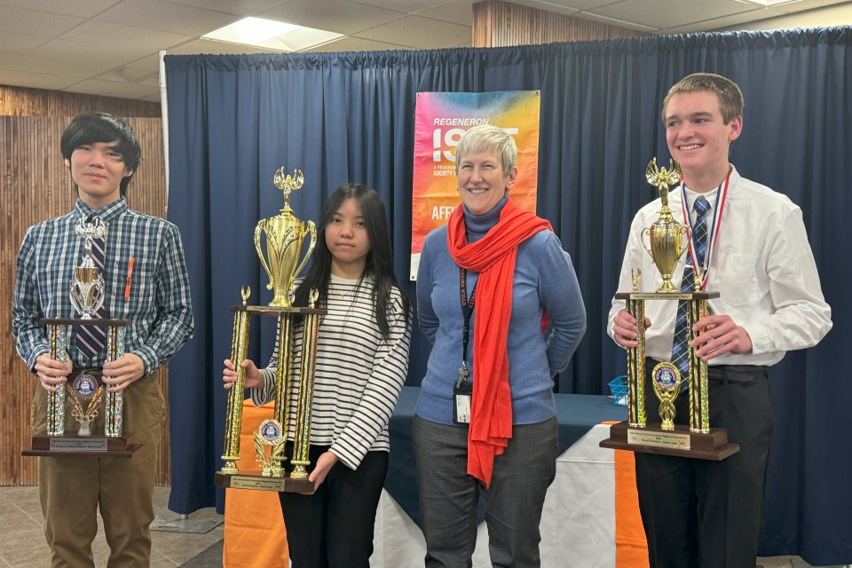 Provost Stephanie Nesbitt stands with winners of the 2024 Regional Science Fair.